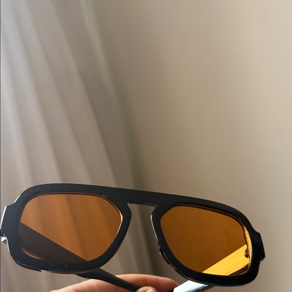 Stylish Black Sunglasses with Orange Lenses